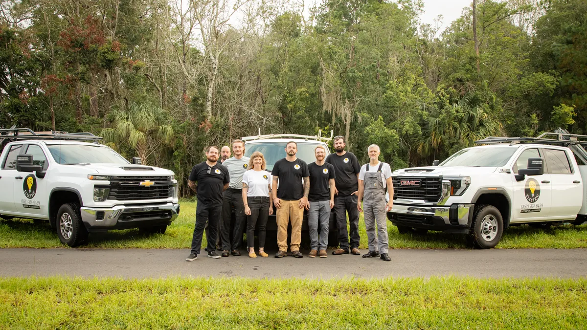 The 352 Electric team of licensed electricians with their service trucks in Gainesville, FL